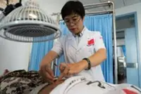 People in western Cambodia experience traditional Chinese medicine treatment