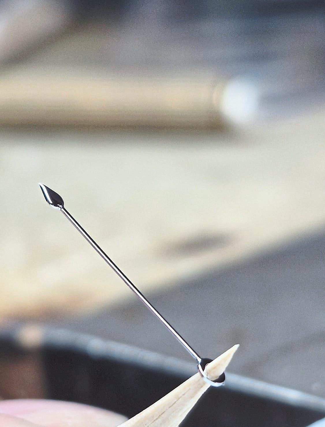 Intricate details of the watch include the elegant steel handset and the black-tulip-like seconds hand.