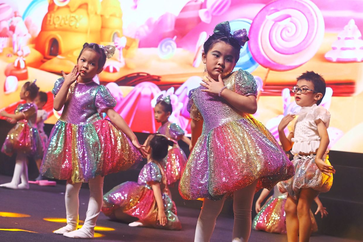 Children performing a dance during the Hui Yin Seh charity event.