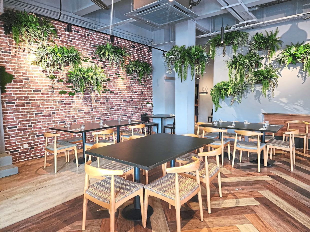 The restaurant has an easy charm, bolstered by the foliage scattered throughout.