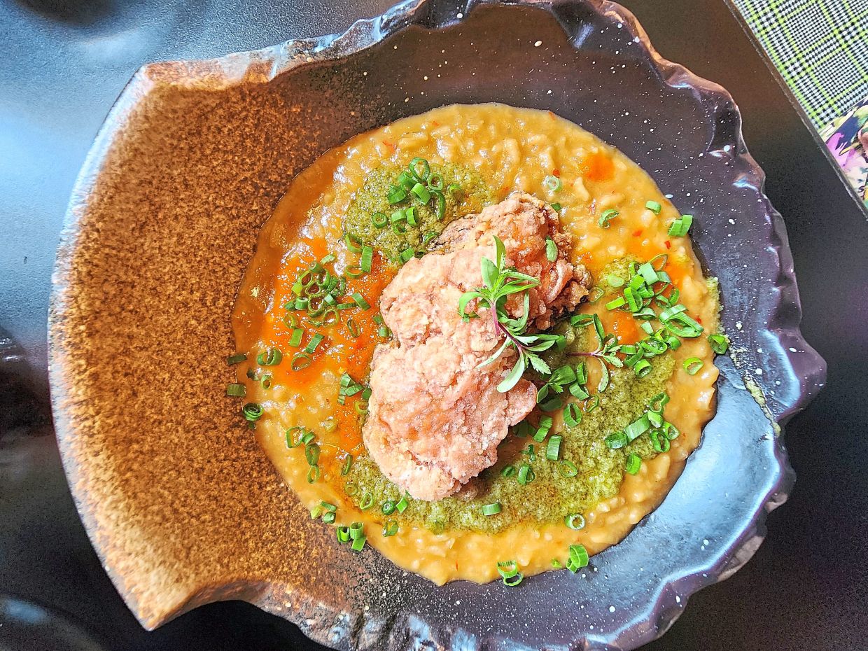 The risotto has been fashioned out of all the ingredients typically associated with chicken rice. — ABIRAMI DURAI/The Star