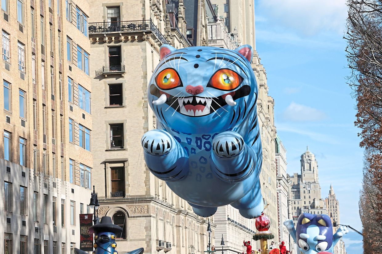 5. A Derpy Tiger balloon from the film ‘KPop Demon Hunters’ floating along the parade route. — Reuters
