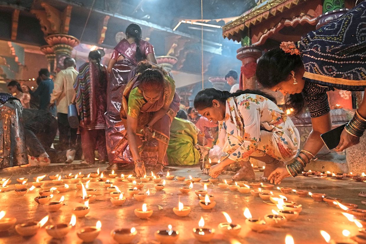 3. Hindus lighting earthen lamps at a temple in Hyderabad on Karthik Purnima, celebrated on the full moon day of the Hindu month of Karthika, which coincides with November’s Beaver Moon. — AP