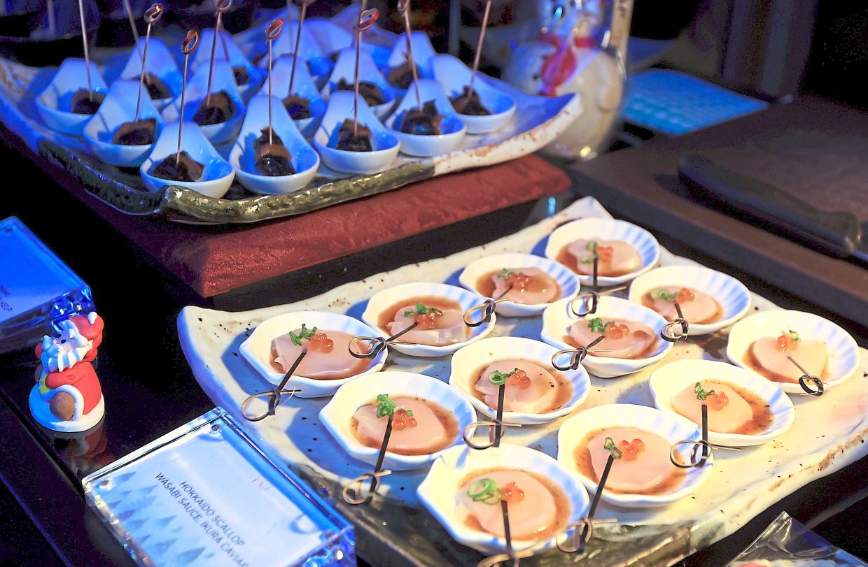 On Christmas eve, Kampachi is offering a five-course menu that includes Thinly Sliced Hokkaido Scallop. 