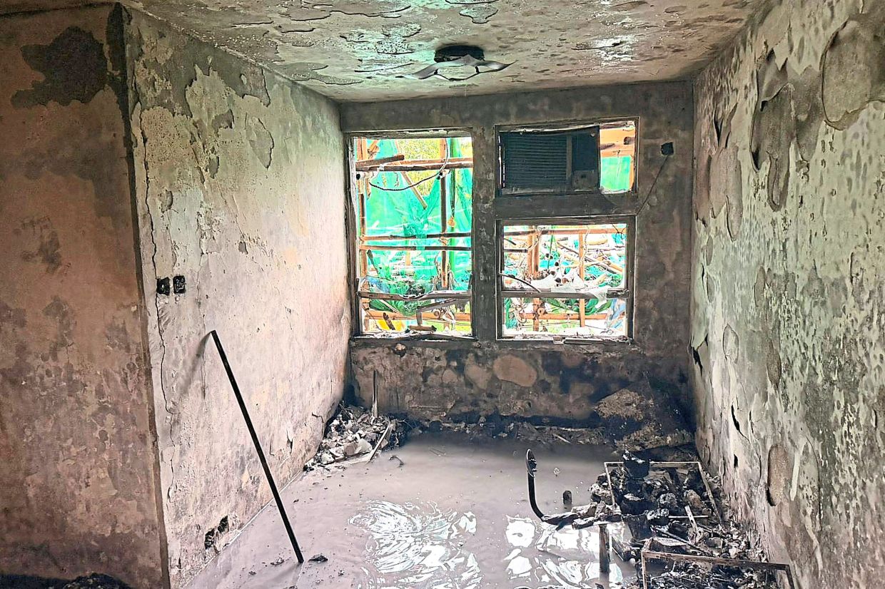 What was once a home: The view of a burnt out apartment is seen in the aftermath of the deadly fire at Wang Fuk Court. — AP 
