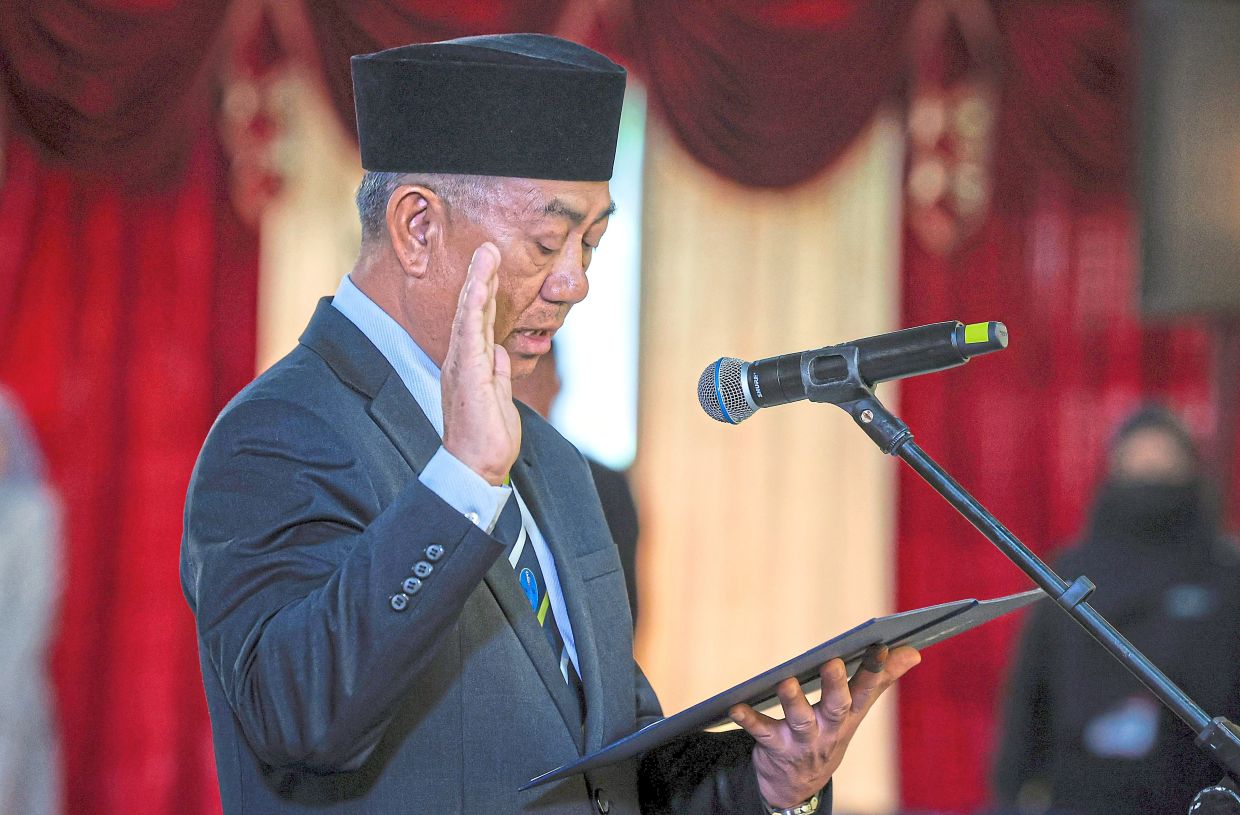 Fresh term: (From left) Joachim taking his oath of office — Bernama