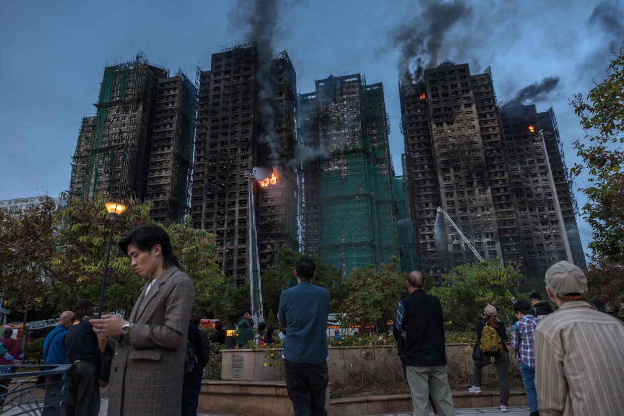 Hong Kong arrests 13 in fire probe as death toll hits 151