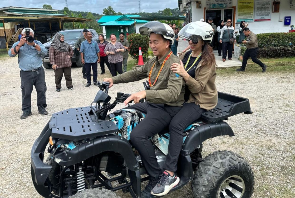 Sabah Forestry Department’s Chief Conservator of Forests Datuk Frederick Kugan and wife trying out the ATV, one of the activities offered at the Sungai Pin Conservation Area during their recent visit.