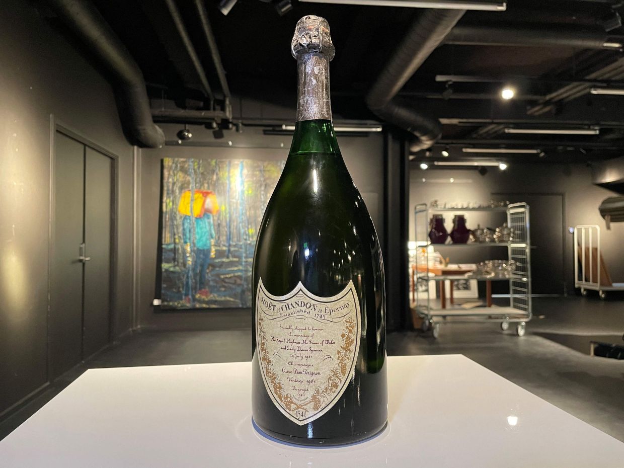 A magnum of Champagne served at Princess Diana and Prince Charles 1981's wedding is on display at the auction house Bruun Rasmussen in Kongens Lyngby, near Copenhagen, Denmark, on November 28, 2025. — Photo: Camille BAS-WOHLERT/ AFP