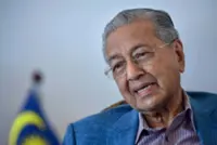 Dr M lodges police report against PM over US trade deal