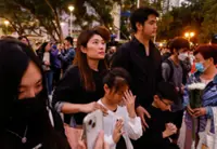Hong Kong orders judge-led inquiry into fire that killed 156