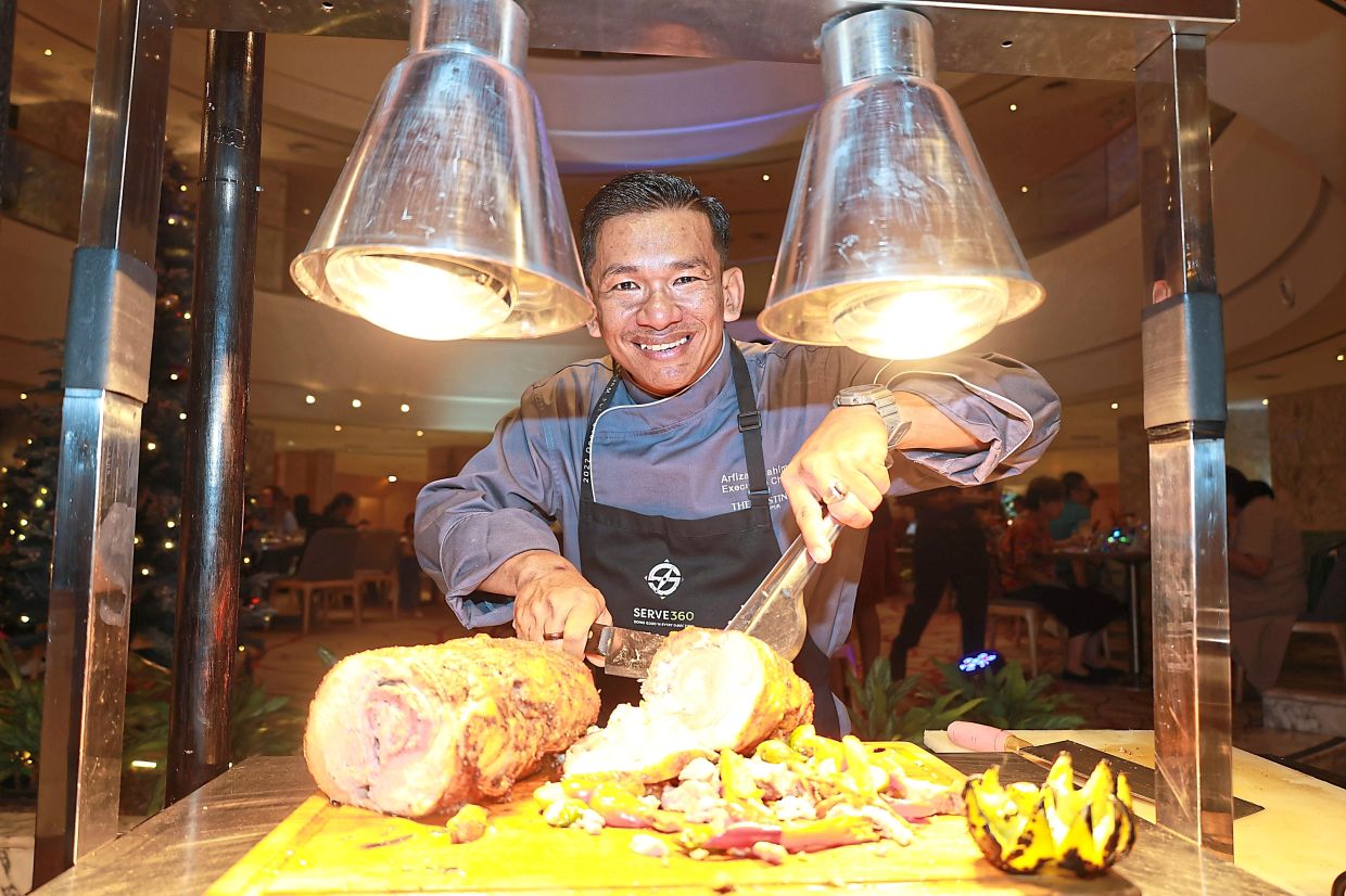 Arfizan slicing the Roasted Turducken Roulade.