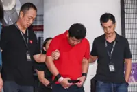 Man accused of murdering his wife in Chinatown hotel room taken back to crime scene