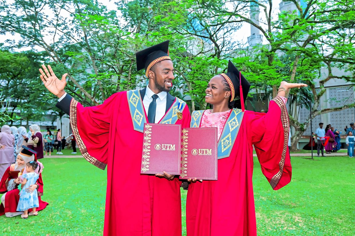 Omalla Morgan (left) and Chanda jubilant after completing their degrees.