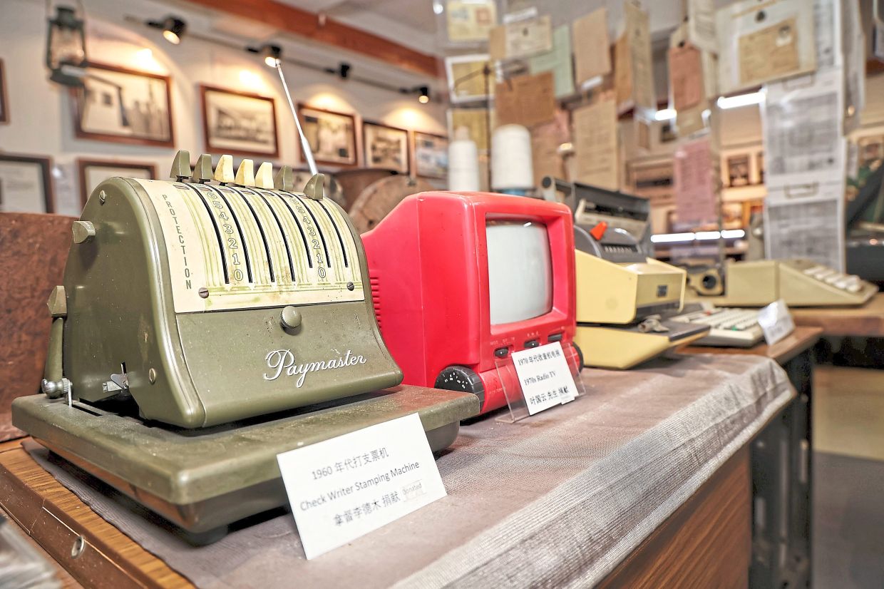 A cheque writer stamping machine among antiques at the Historical Corridor in Kampung Baru Seri Setia.