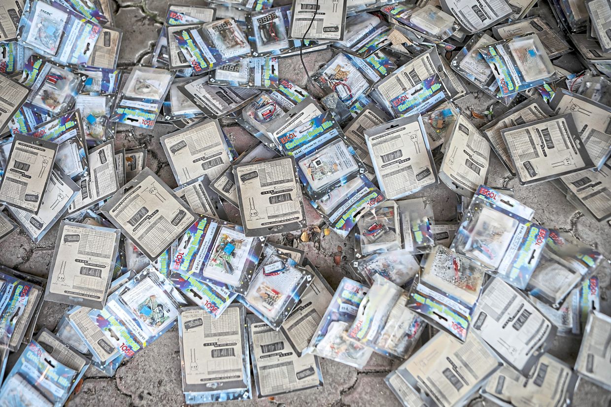 Recovery efforts:Volunteers from the Human Resources Ministry and ADTEC students participating in the post-flood clean-up programme, clearing debris.