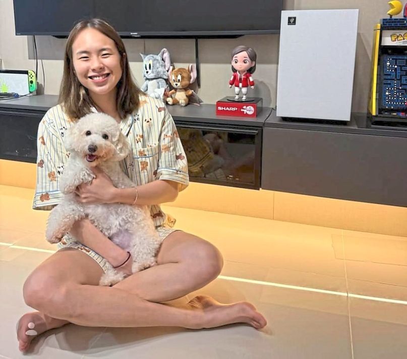 Cuddly companion: Pearly Tan with her dog Whiskey.