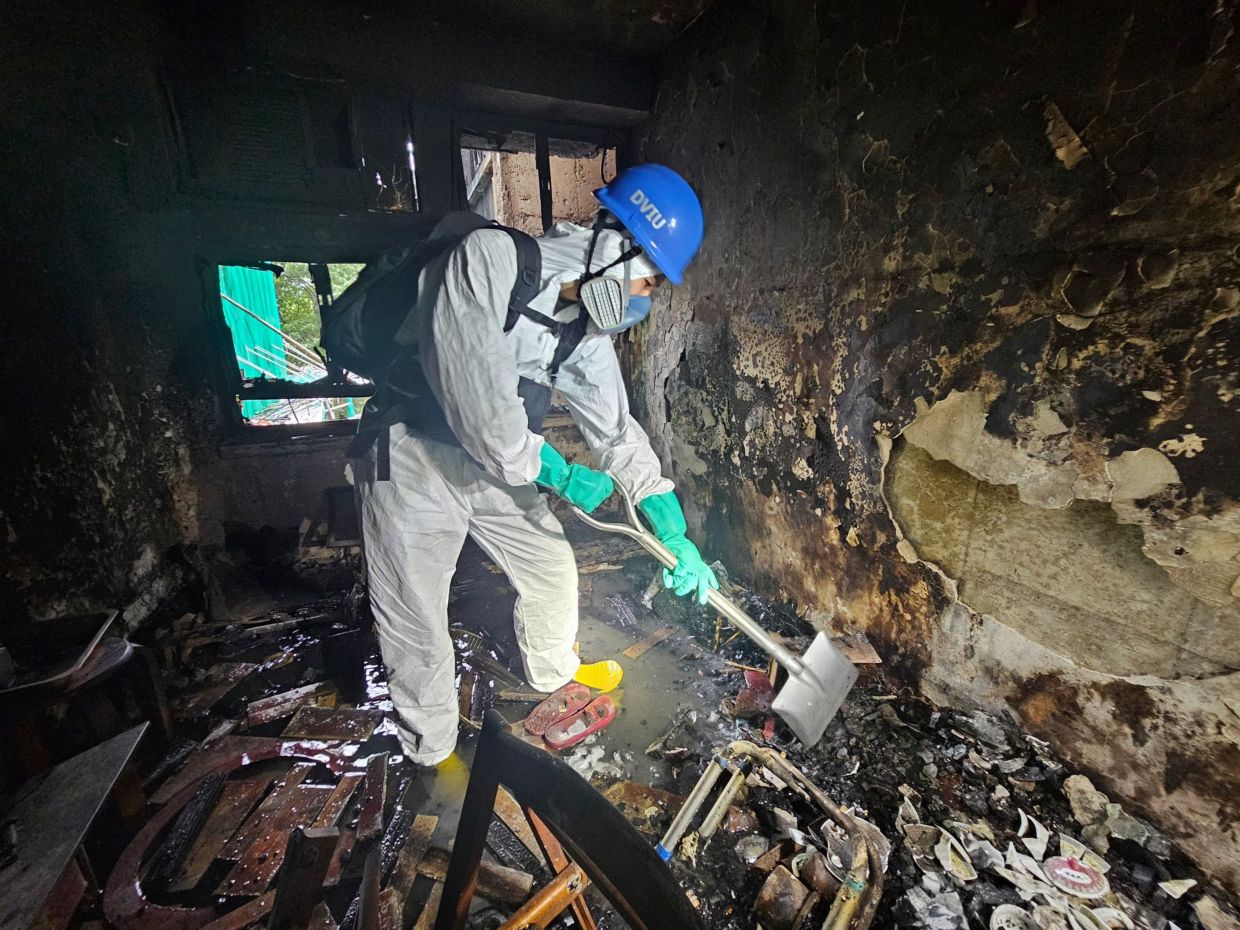 'Plain madness' - Digging through Hong Kong’s disaster site left rescuers wanting to cry