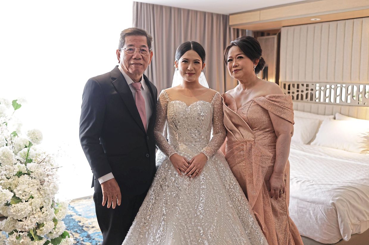 A week after his surgery, Eddy (left) flew back to Indonesia to walk his eldest daughter Anatasya down the aisle.