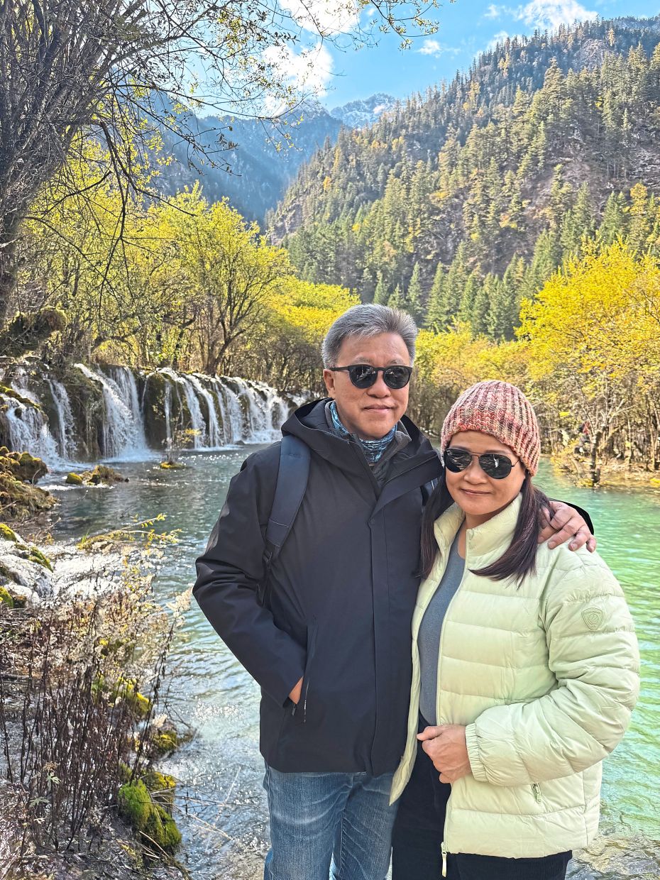 The writer with his wife, Florence Teh, at one of the beautiful waterfalls at Jiuzhaigou.