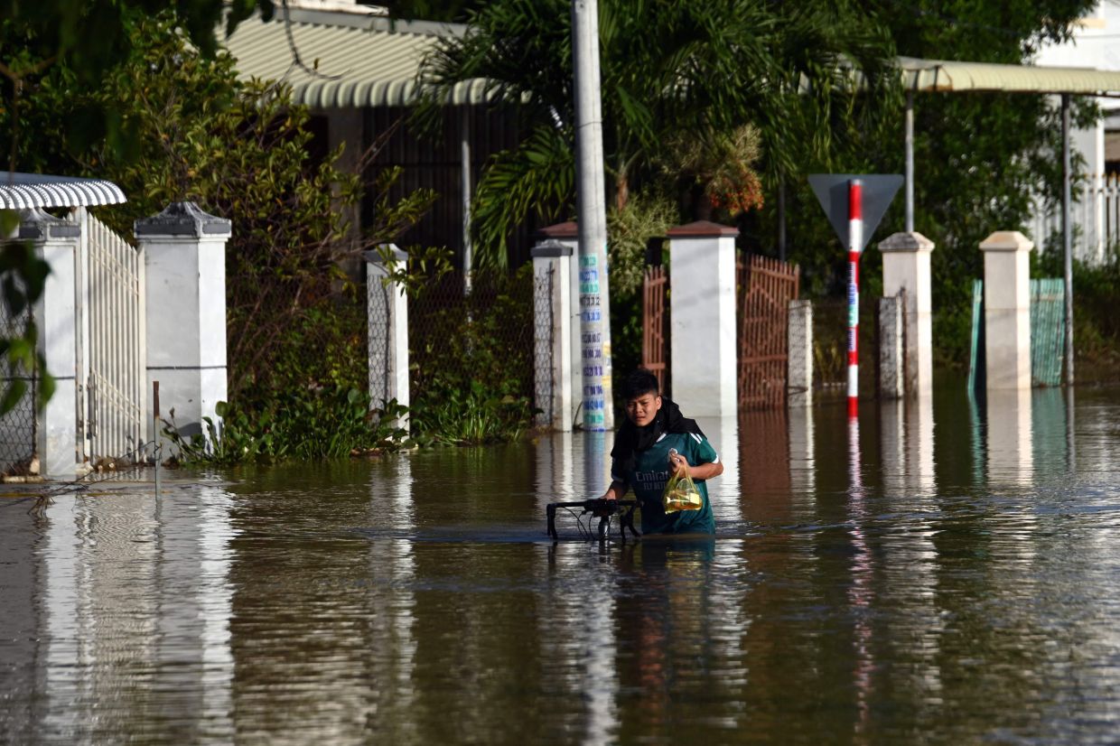Flooding kills two as Vietnam hit by dozens of landslides