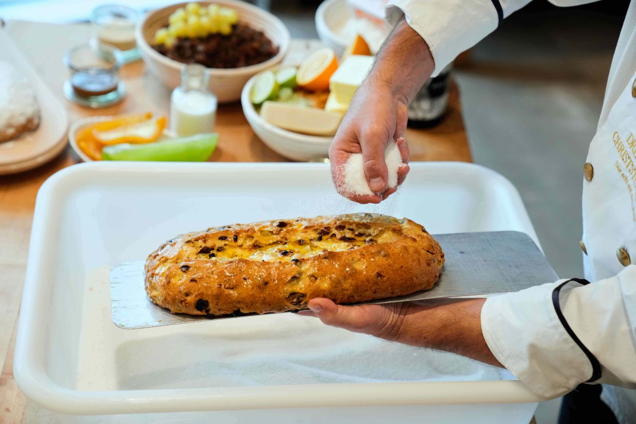 Pastry chef Tino Gierig makes stollen a traditional Christmas pastry in Dresden, Germany, Tuesday, Nov. 11, 2025. (AP Photo/Ebrahim Noroozi)