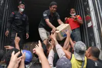 Indonesian military steps up relief efforts for flood-hit Sumatra; death toll above 860