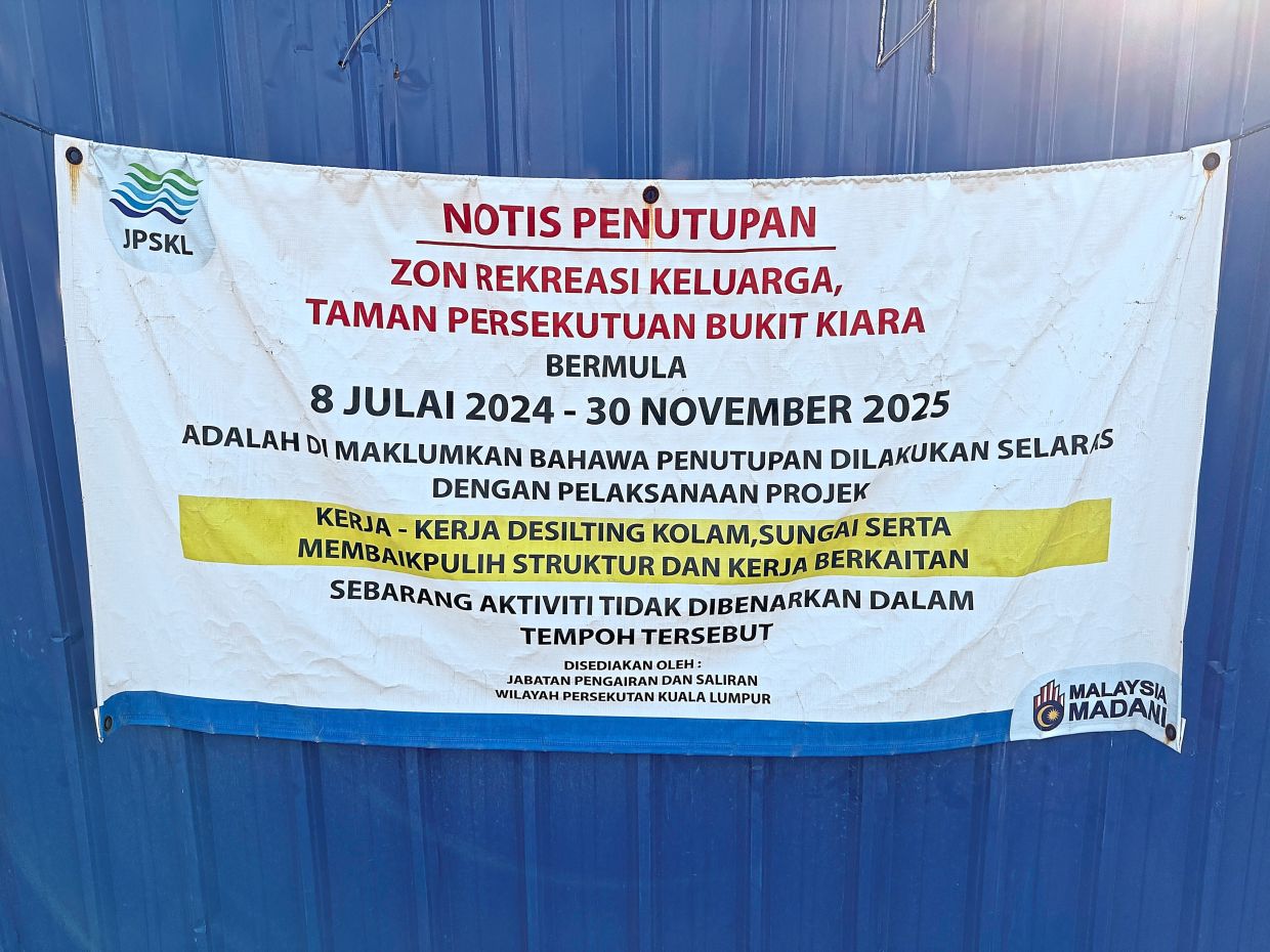 A banner at the park states that the completion date for Bukit Kiara park is Nov 30.