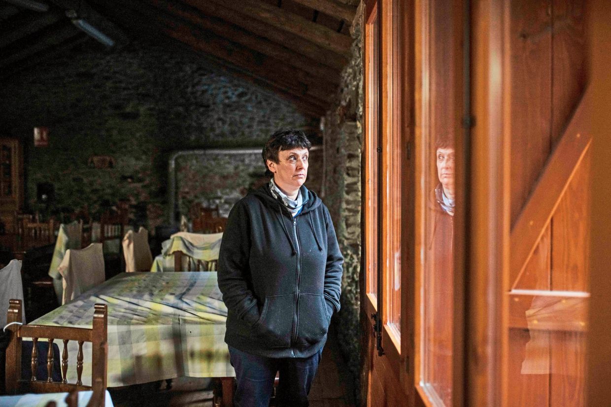 Tomas, the owner of Casa Sisqueta in Tor, has become a character for true-crime enthusiasts visiting the town. — Maria Contreras Coll/The New York Times