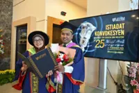 Mom earns PhD as son graduates on same day