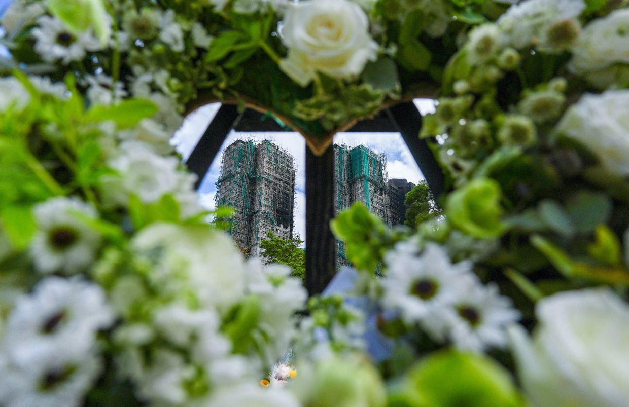 Judge-led panel to probe deadly blaze as Hong Kong goes ahead with election