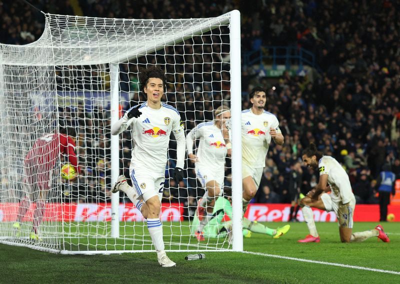 Soccer-Tanaka on target as Leeds snatch 3-3 draw with Liverpool