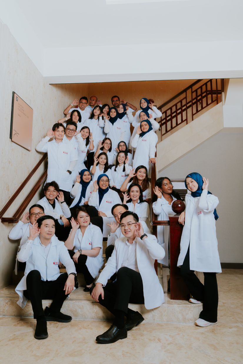 Mok (first row, left) founded 20db in 2002 to establish centres for holistic audiological care.