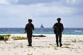 Philippines says China fired flares toward its patrol plane in the disputed South China Sea