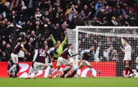 Soccer-Aston Villa stun leaders Arsenal, Man City close gap to two points, Liverpool held by Leeds