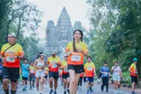 Around 16,000 participants run an international half-marathon at Cambodia's historic Angkor Wat