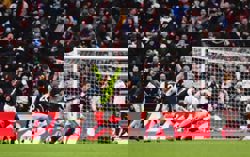 Soccer-Aston Villa stun leaders Arsenal, Man City close gap to two points, Liverpool held by Leeds