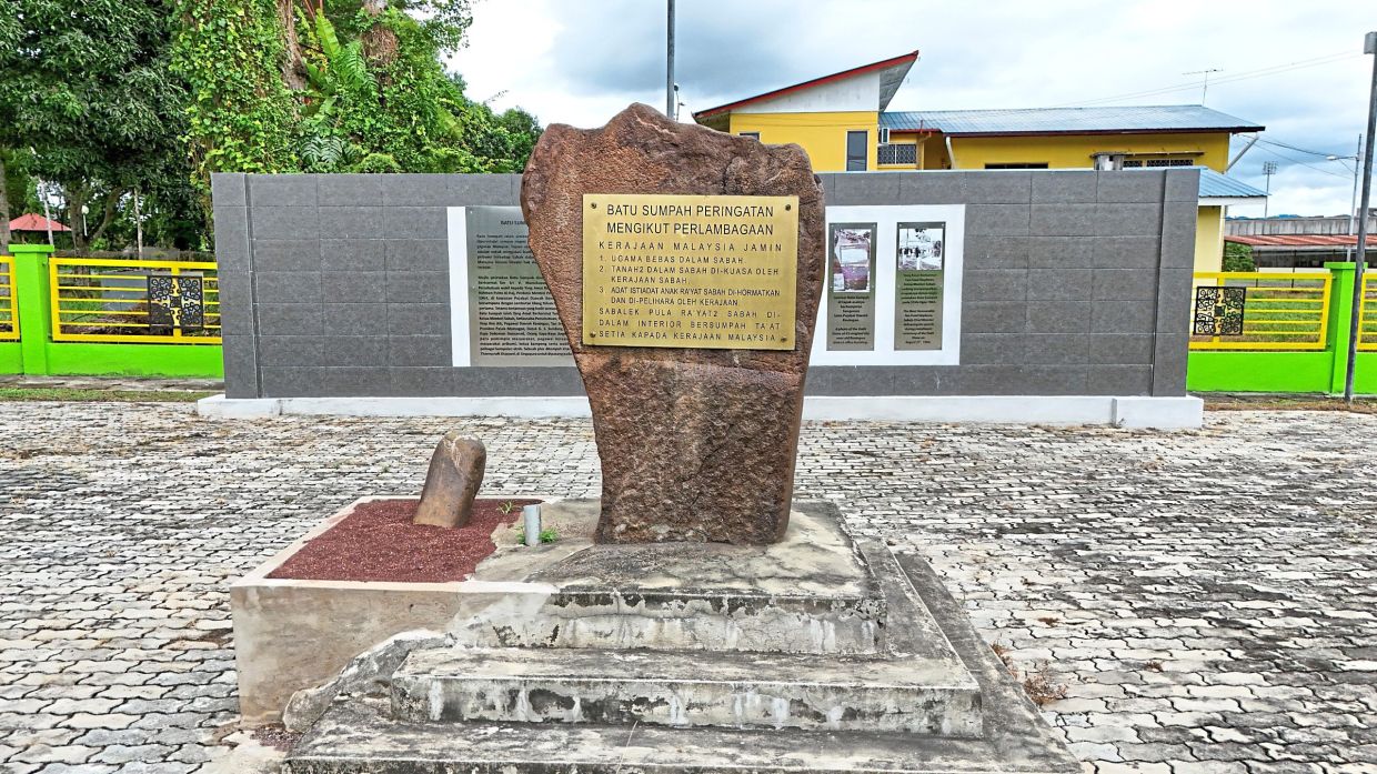 The restored Keningau Oath Stone site — with its main monolith and explanatory panels — now stands as a public memorial in Keningau.