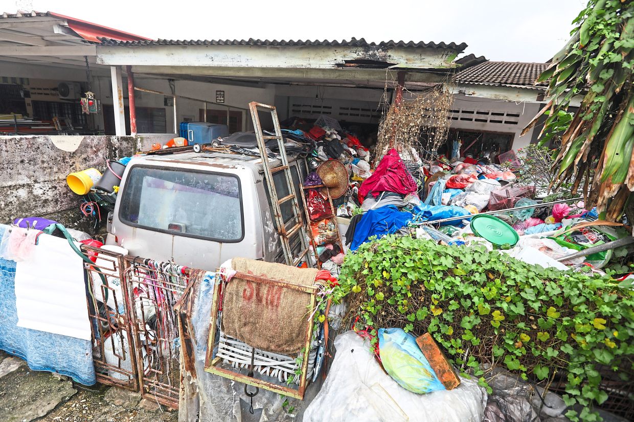A house in Jalan Awan Kecil 5 filled with all sorts of rubbish and recyclables.