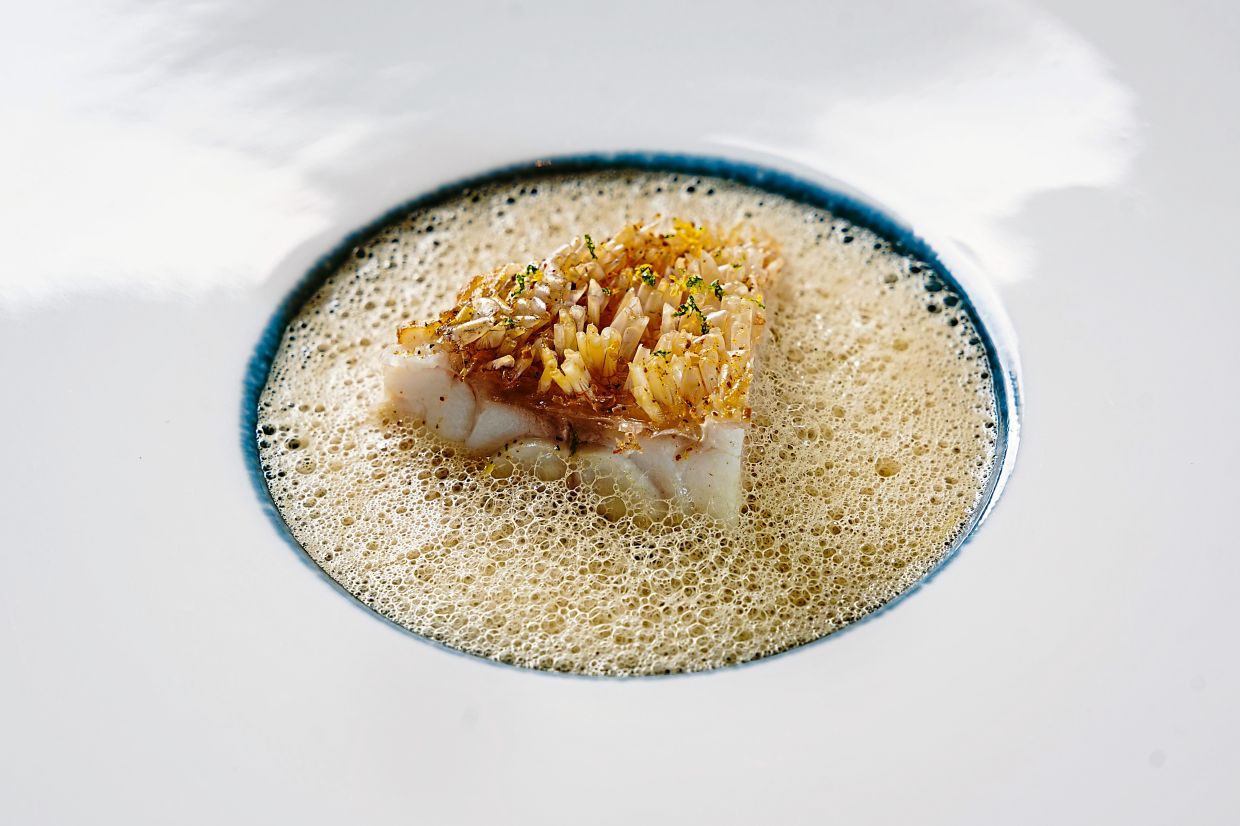 The amadai features crispy scales and firm flesh set against a Kerala-influenced foam. — Thevar