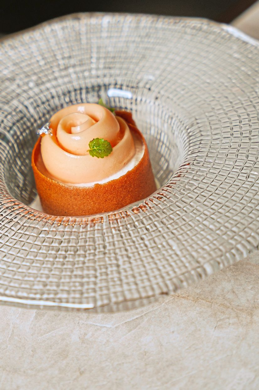 The dessert features a humble Indian payasam contrasted against premium French musk melon.