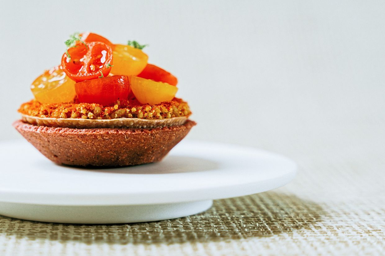 Bursts of freshness and sweetness underscore the natural beauty of the tomato chaat. — Thevar