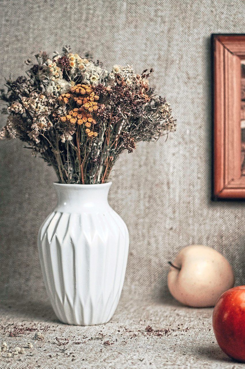 Leftover wedding flowers can be dried and re-used to decorate homes, or given away as gifts.