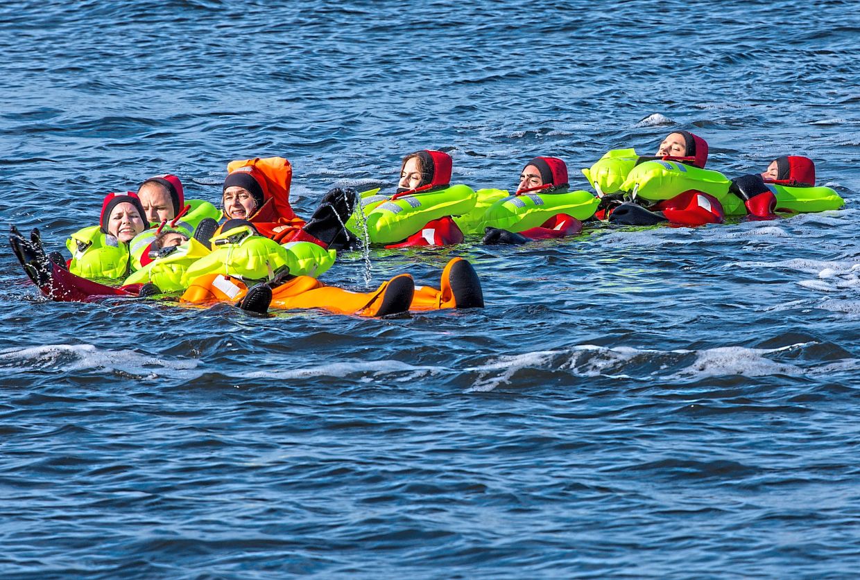 Eight potential astronauts from seven European countries receive water rescue training in the Baltic Sea near the northern east German city of Rostock.