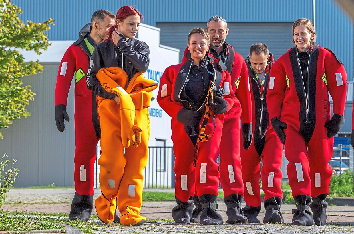 Schonenwald (third from left) wearing a survival suit during a training session with other potential European Space Agency astronauts.