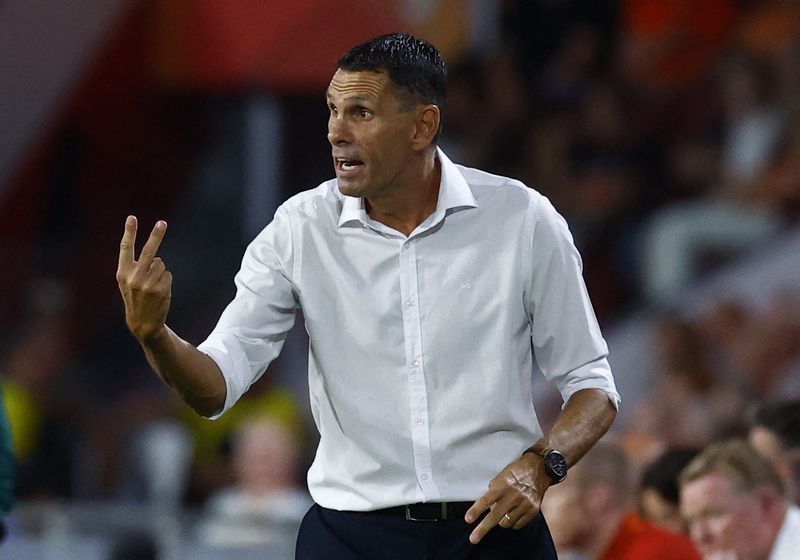 Soccer-Jeonbuk confirm departure of title-winning coach Poyet