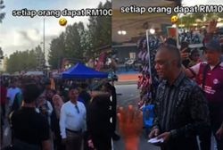 'Millionaire Man' hands out RM100 cash to Klebang Beach visitors