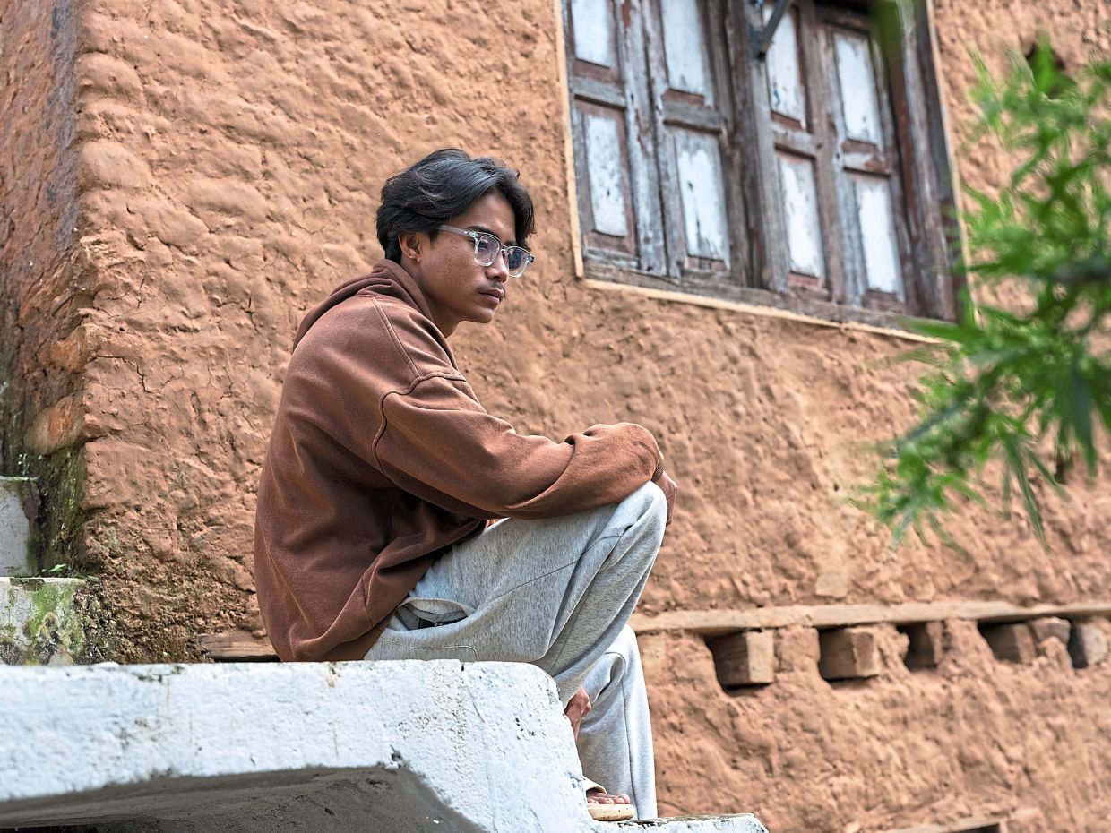 Rajendra Tamang, of Chamkhar, says there are no prospects for him in his home village, and the rest of Nepal has little more to offer, Oct. 6, 2025. The protests that rocked Nepal were about more than a social media ban. The economy is so dire that for many, going abroad seems the only way to build a future. (Uma Bista/The New York Times)