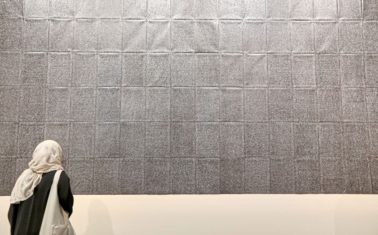 Ng’s 'A State Of Resilience' (needle punched photocopied paper, 2025) artwork seen at the Ilham Art Show 2025. Photo: The Star/Low Lay Phon