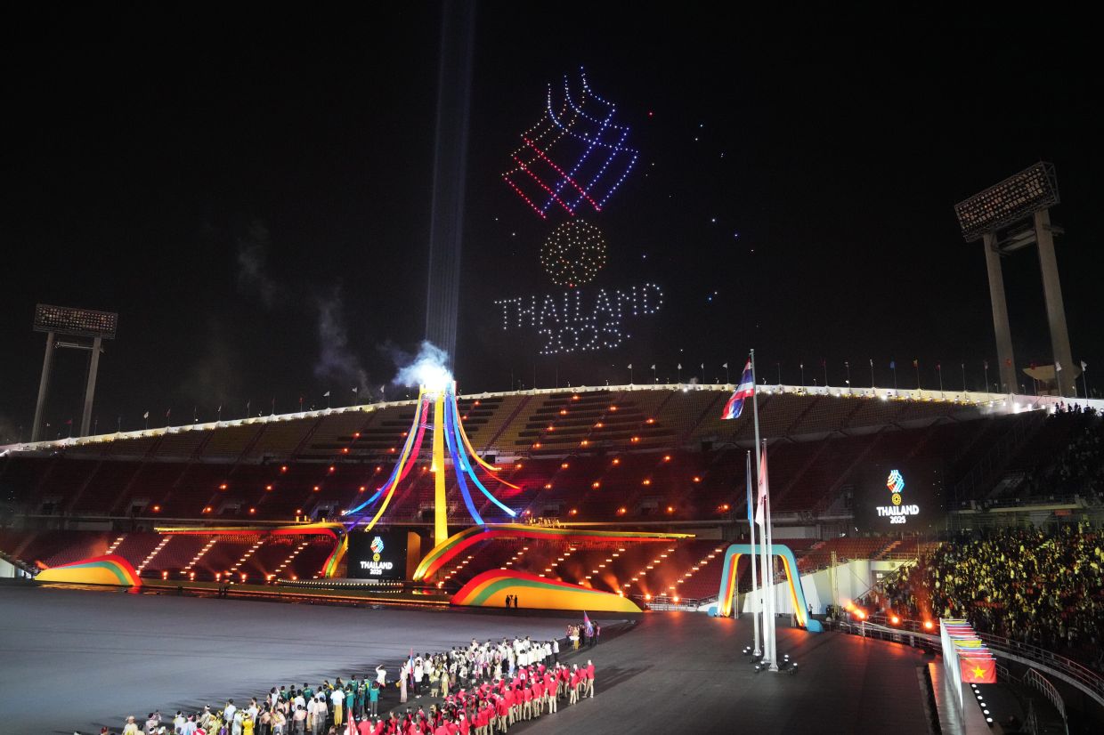 Spectators watch a drone light show during the opening ceremony of the 33rd South-East Asian Games in Bangkok, Thailand, Tuesday, Dec. 9, 2025. -- AP Photo/Achmad Ibrahim